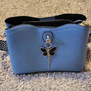 Elegant Blue Handbag with Butterfly Charm